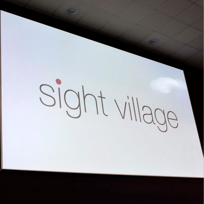 sight village logo on a projector screen